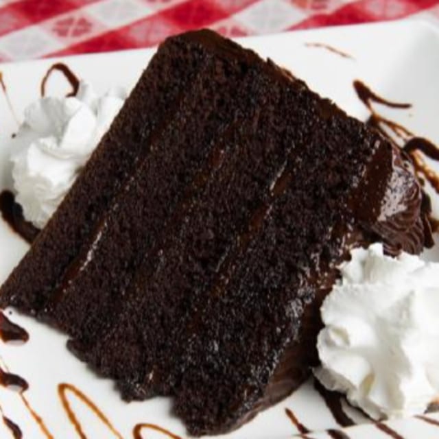 Triple Chocolate Fudge Cake Slice.