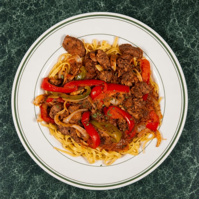 Chicken Liver Ala Caruso over Fettuccini.