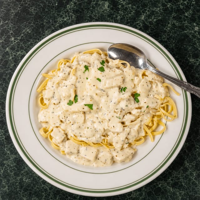 Chicken Alfredo over Fettuccini.